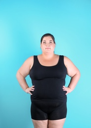 Photo of Overweight woman before weight loss on color background
