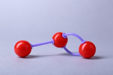 Photo of Molecular atom model on light grey background. Chemical structure