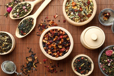 Many different herbal teas on bamboo mat, flat lay