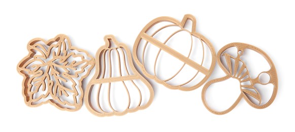 Photo of Cookie cutters of different shapes on white background, top view