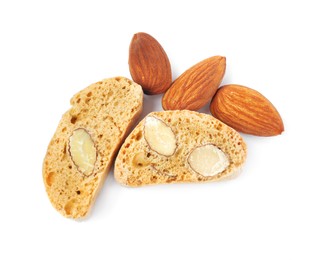 Slices of tasty cantucci and nuts on white background, top view. Traditional Italian almond biscuits