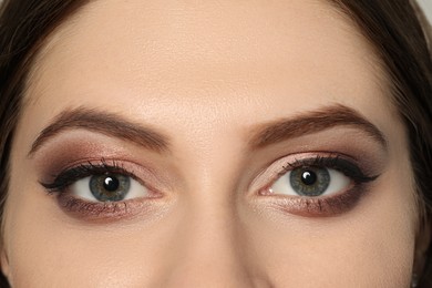 Photo of Young woman with beautiful eyebrows, closeup view