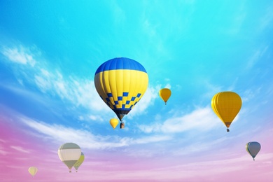 Fantastic dreams. Hot air balloons in bright sky with clouds  