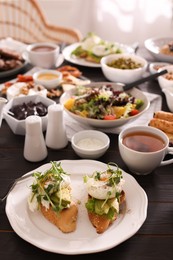 Delicious sandwiches and many different dishes served on buffet table for brunch
