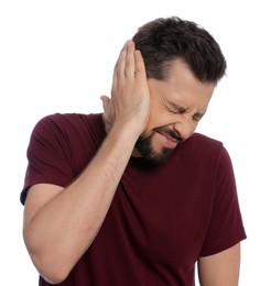 Photo of Man suffering from ear pain on white background