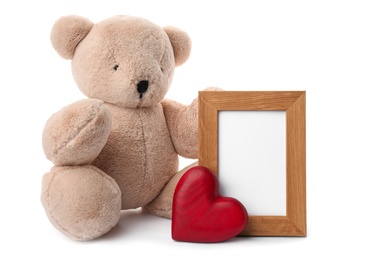 Cute teddy bear with red heart and frame on white background. Valentine's day celebration