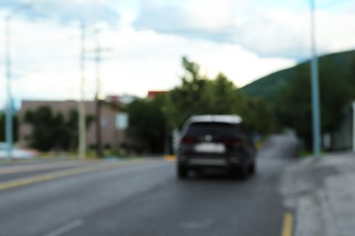 Blurred view of car on asphalt highway outdoors