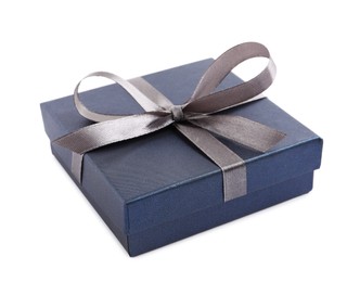 Blue gift box with satin bow on white background