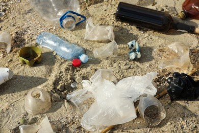 Garbage scattered on beach. Environment pollution problem
