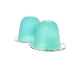 Delicious light blue jelly cups on white background