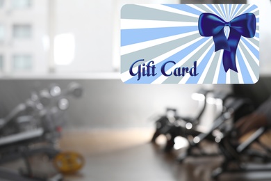 Gym gift card. Blurred view of health club with modern equipment