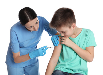 Doctor vaccinating little child on white background