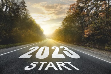 Start new year with fresh vision and ideas. 2023 numbers on asphalt road