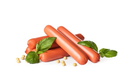 Raw vegetarian sausages with soybeans and basil on white background
