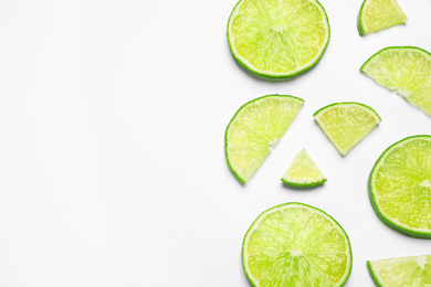 Juicy fresh lime slices on white background, top view