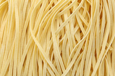 Quick cooking noodles as background, closeup view