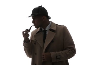 Old fashioned detective with smoking pipe on white background