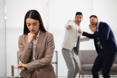 Coworkers bullying their colleague in office, space for text