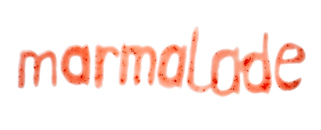Word MARMALADE written with sweet berry jam on white background