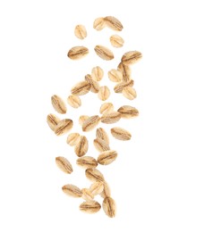 Dry uncooked oatmeal falling on white background