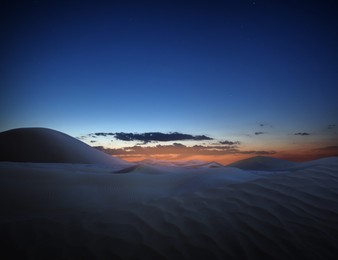 Image of Scenic view of sandy desert at sunset 