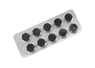 Activated charcoal pills in blister isolated on white, top view. Potent sorbent