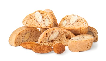 Slices of tasty cantucci and nuts on white background. Traditional Italian almond biscuits