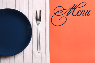 Elegant table setting and word menu on orange background, flat lay. Space for text