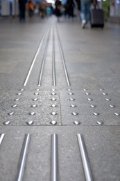 Floor tiles with tactile ground surface indicators, closeup view