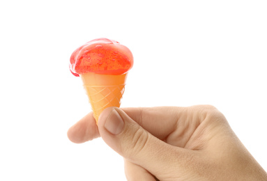 Photo of Woman holding slime in shape of ice cream isolated on white, closeup. Antistress toy