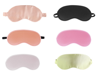 Set of different sleeping eye masks on white background, top view. Bedtime