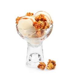 Delicious ice cream with caramel popcorn and sauce in glass dessert bowl on white background