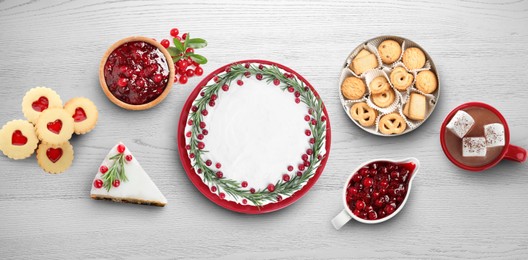 Flat lay composition with different delicious pies on white wooden table. Banner design