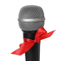 Microphone with red bow isolated on white, closeup. Christmas music