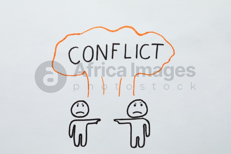 Photo of Conflict concept. Drawn explosion cloud over two annoyed humans pointing at each other on white paper