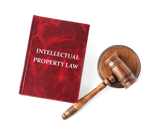 Intellectual Property law book and judge's gavel on white background, top view