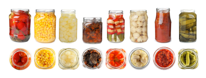 Set of jars with pickled vegetables and mushrooms on white background. Banner design