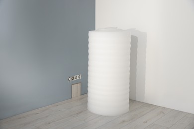 Roll of polyethylene foam in room prepared for renovation