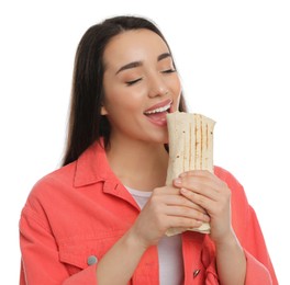 Young woman eating tasty shawarma isolated on white