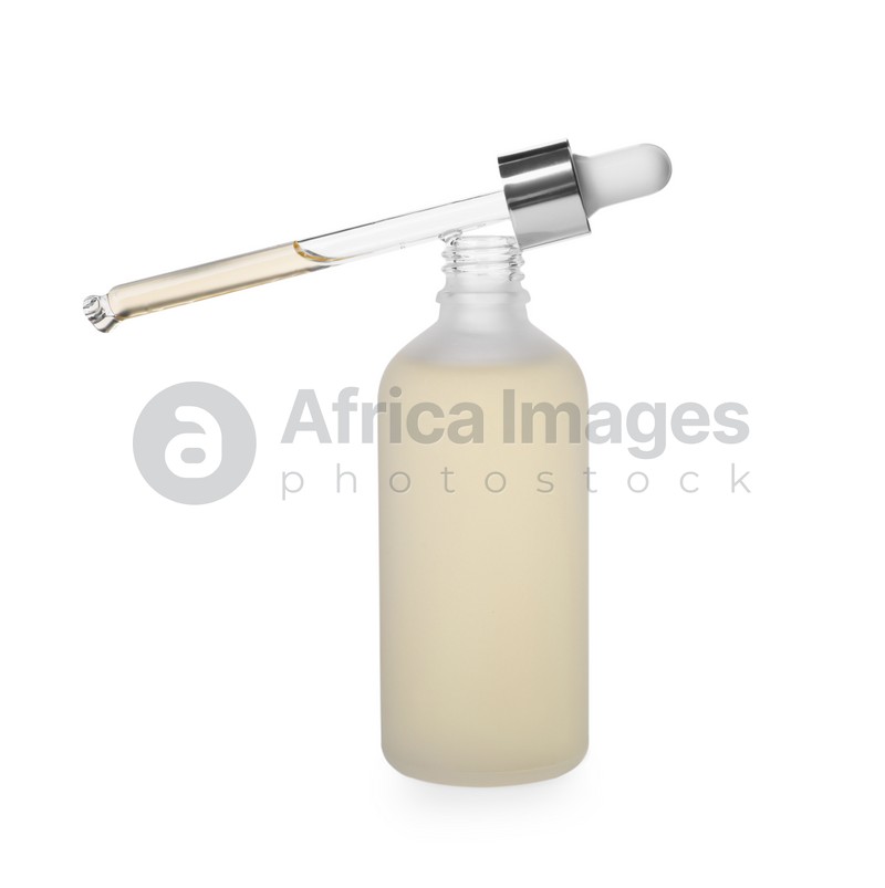 Bottle of hydrophilic oil and pipette on white background
