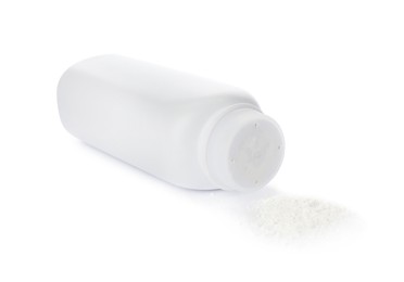 Photo of Bottle and scattered dusting powder on white background. Baby cosmetic product