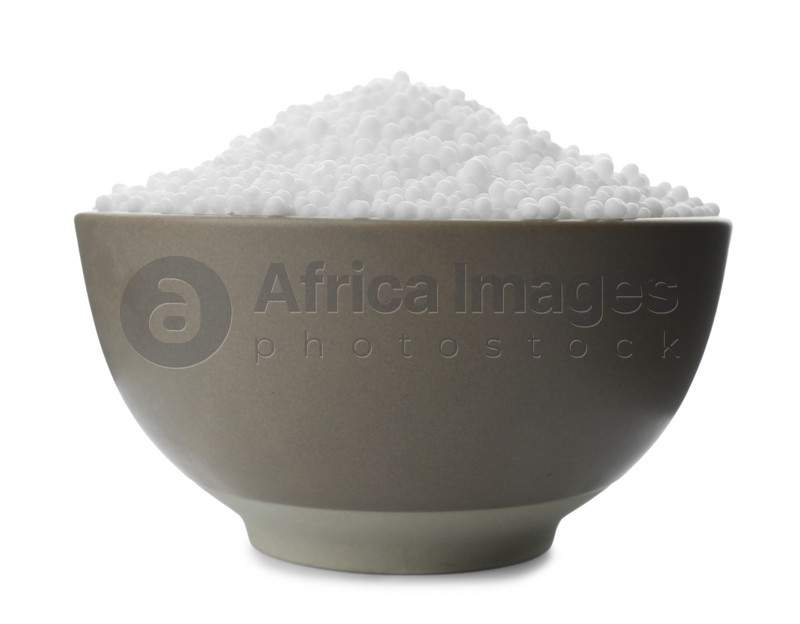 Pellets of ammonium nitrate in bowl isolated on white. Mineral fertilizer