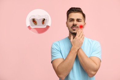 Young man suffering from toothache on pink background