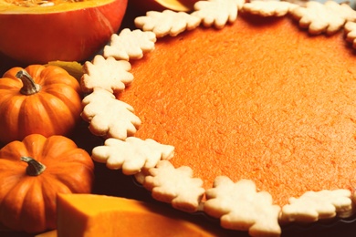 Closeup view of pumpkins and delicious homemade pie
