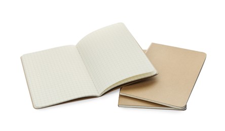 Stylish open notebook with blank sheets and kraft planners on white background