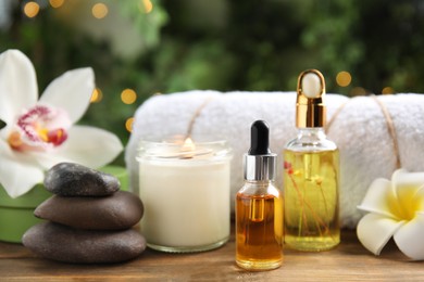 Photo of Composition with spa cosmetic on wooden table
