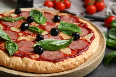 Delicious homemade pita pizza on grey table, closeup