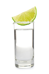 Mexican Tequila shot with salt and lime slice isolated on white