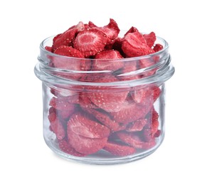 Freeze dried strawberries in glass jar on white background