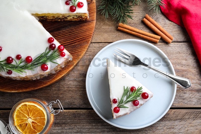 Photo of Flat lay composition with traditional Christmas cake on wooden table